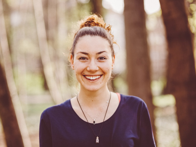woman smiling in woods